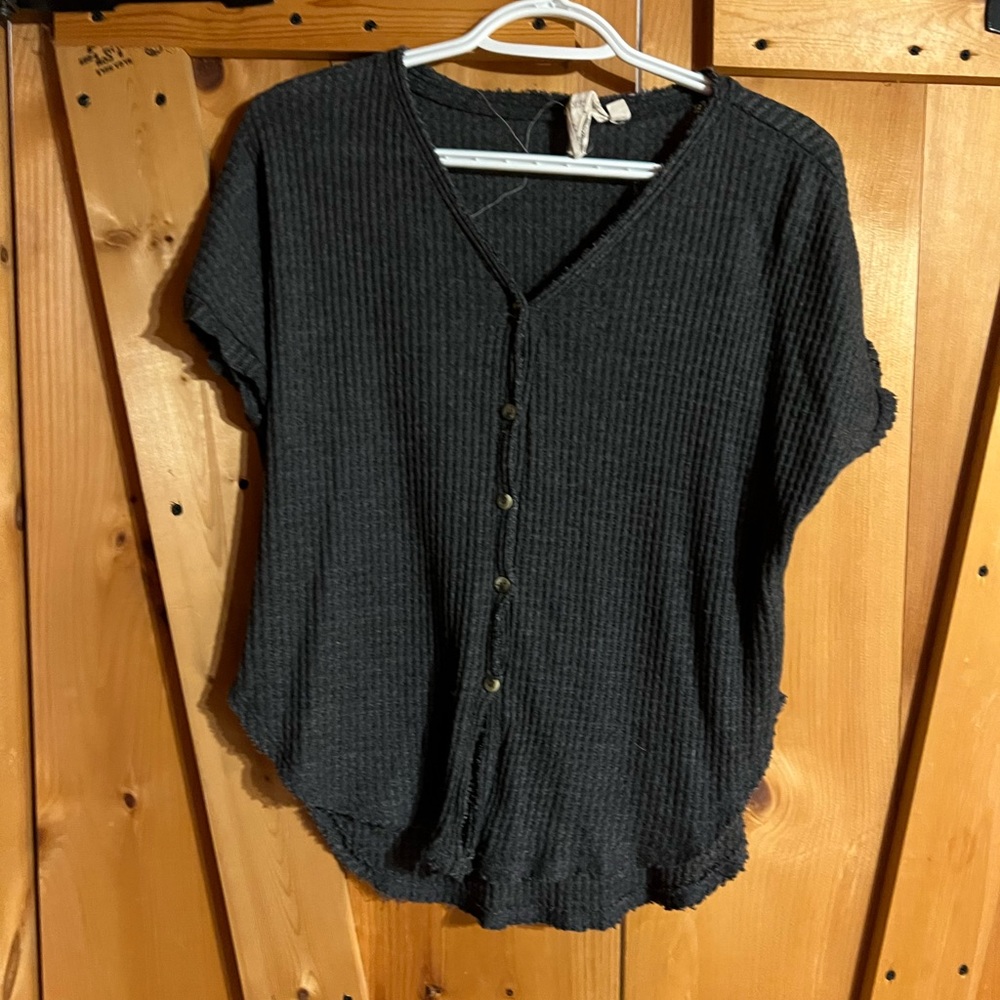 Short sleeve grey button up t-shirt.